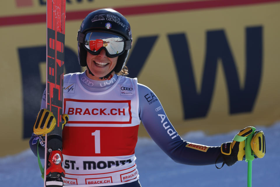 Italy's Federica Brignone smiles at the finish area of an alpine ski, women's World Cup downhill race, in St. Moritz, Switzerland, Saturday, Dec.9, 2023. (AP Photo/Alessandro Trovati)