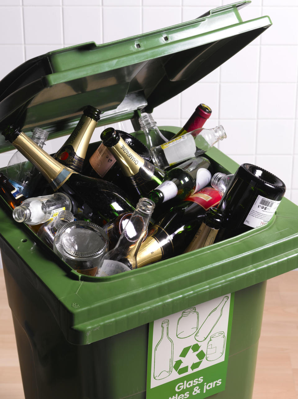 A recycling bin full of bottles