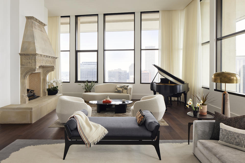 The living area of the great room has an antique fireplace as its focal point.