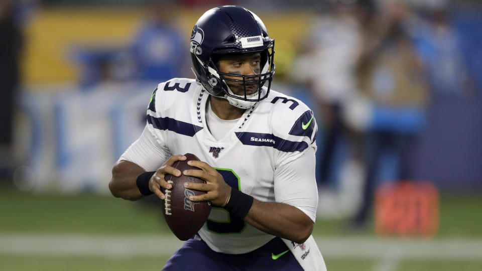 Seattle Seahawks quarterback Russell Wilson passes against the Los Angeles Chargers during the first half of an NFL preseason football game Saturday, Aug. 24, 2019, in Carson, Calif. (AP Photo/Gregory Bull)
