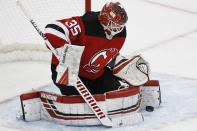 New Jersey Devils goaltender Cory Schneider makes a save during the third period of an NHL hockey game against the St. Louis Blues, Friday, March 6, 2020, in Newark. (AP Photo/John Minchillo)