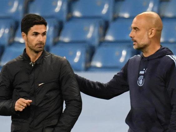 Manchester City manager Pep Guardiola (right) and Arsenal manager Mikel Arteta (Reuters)