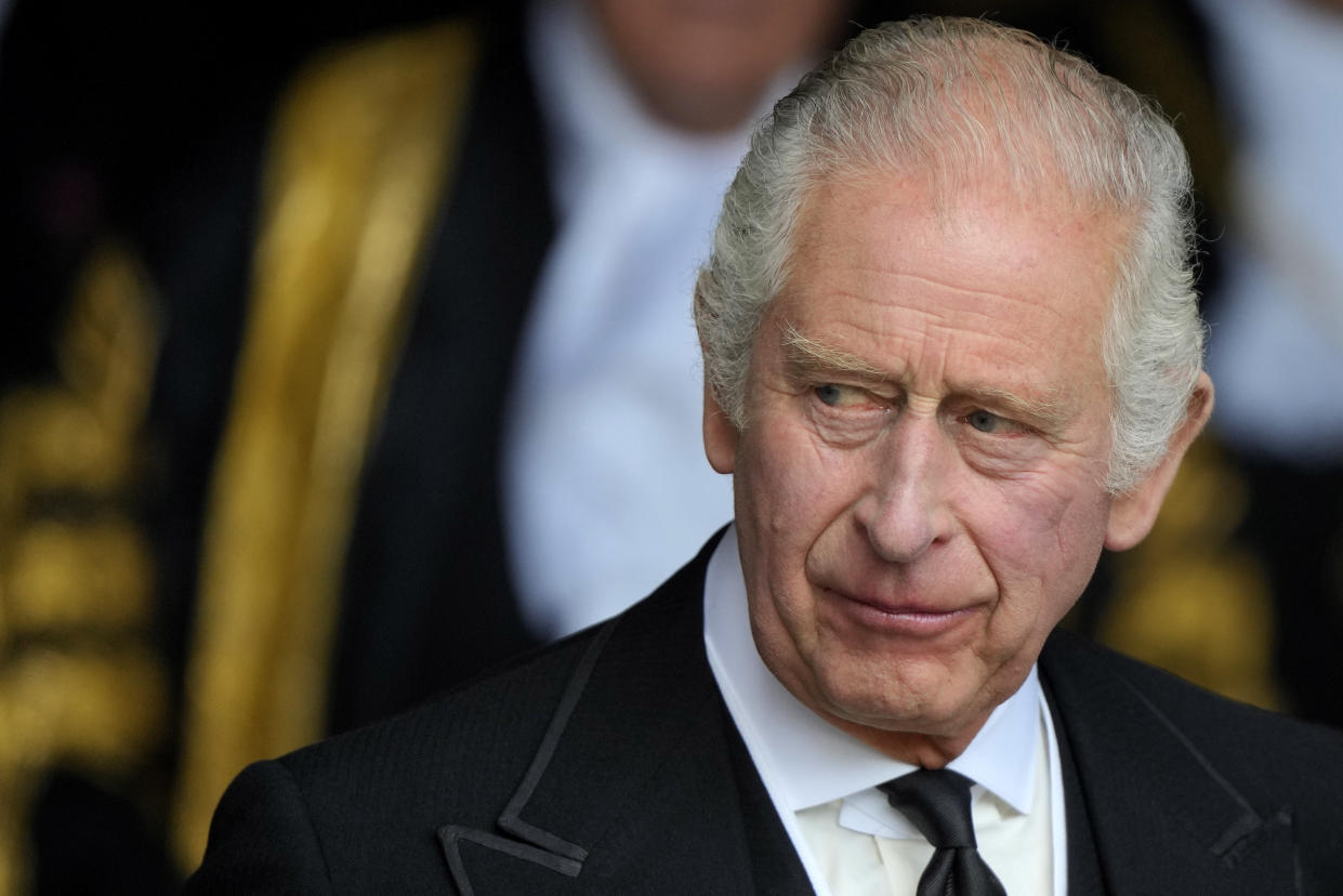 FILE - King Charles III leaves Westminster Hall, in the Palace of Westminster, where the House of Commons and the House of Lords met to express their condolences in London, Monday, Sept. 12, 2022. King Charles III will hope to keep a lid on those tensions when his royally blended family joins as many as 2,800 guests for the new king’s coronation on May 6 at Westminster Abbey. All except Meghan, the Duchess of Sussex, who won’t be attending. (AP Photo/Markus Schreiber, Pool, File)