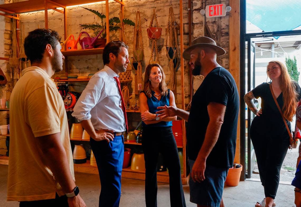 Democratic gubernatorial candidate Joe Cunningham and running mate Tally Casey speak with Michael Mayo while visiting Gardener’s Outpost in the North Main Street district on Thursday, Aug. 25, 2022.