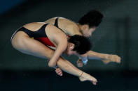 The tape must be waterproof if diver Hao Wang is wearing it. Look closely, it's on her back. (Photo: Clive Rose/Getty Images)