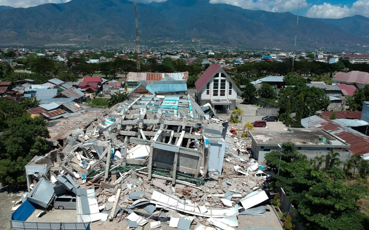 This aerial picture shows the remains of a ten-storey hotel in Palu - AFP