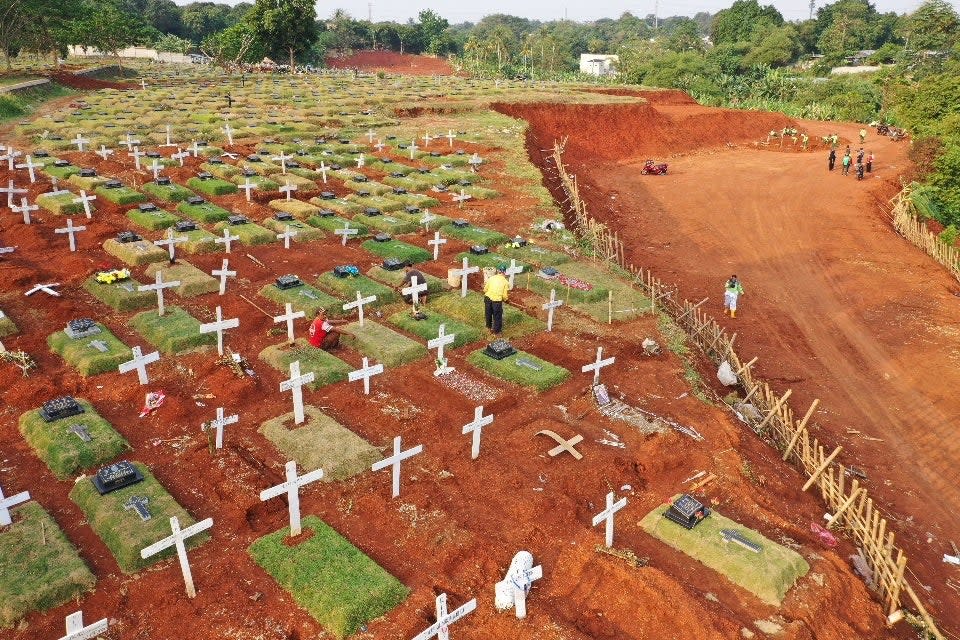 The health protocol violators were not involved in the actual burials (AFP via Getty Images)