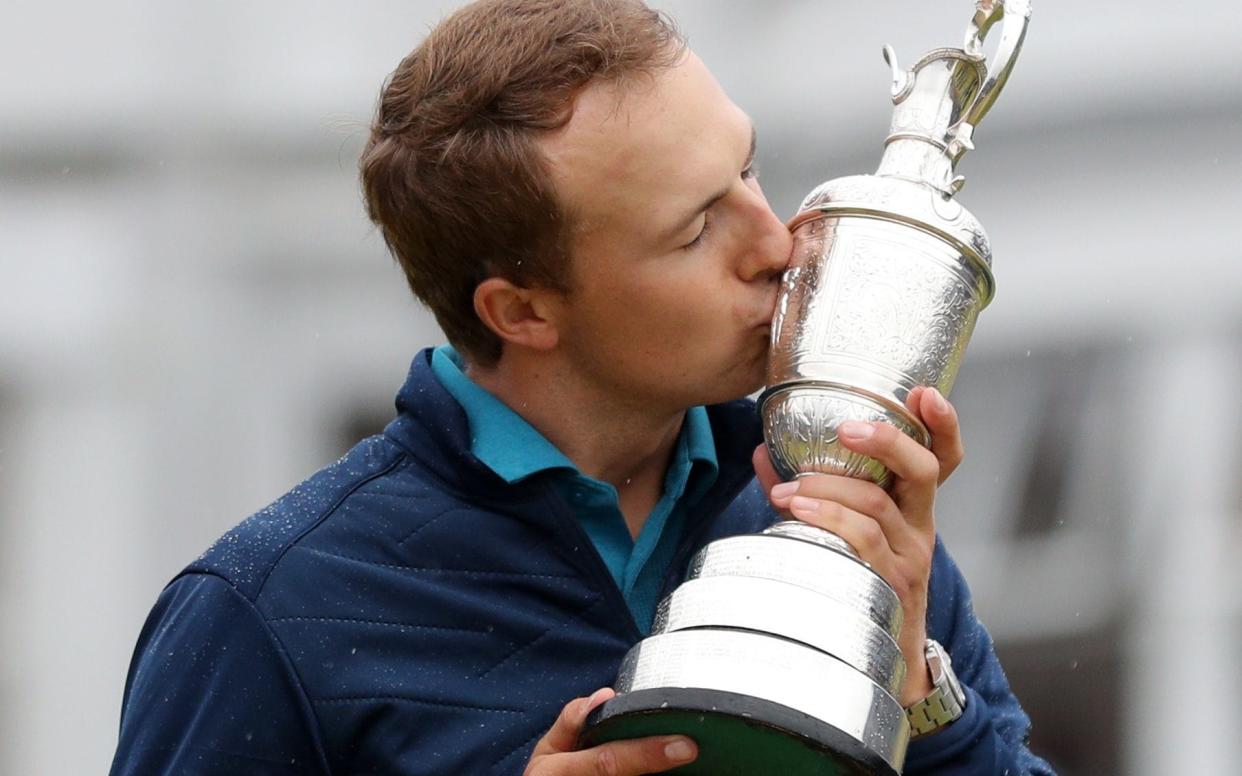 Jordan Spieth plants a kiss on the Claret Jug - PA