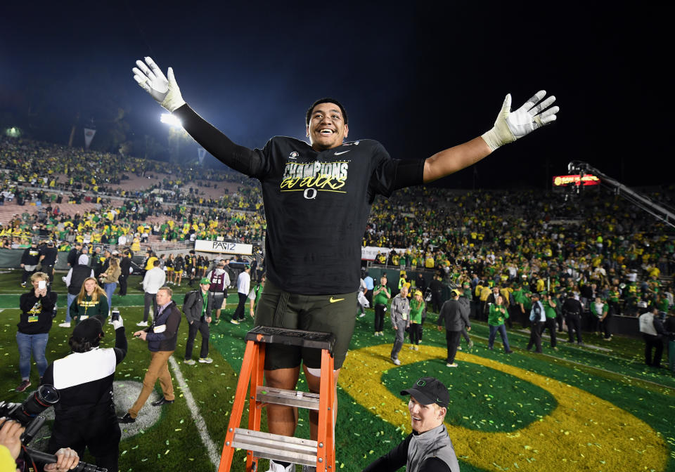 If all goes well for Penei Sewell on the first night of the NFL draft, his smile will be even bigger than when the Ducks defeated Wisconsin to become the 2020 Rose Bowl Champions. (Photo by John Cordes/Getty Images)