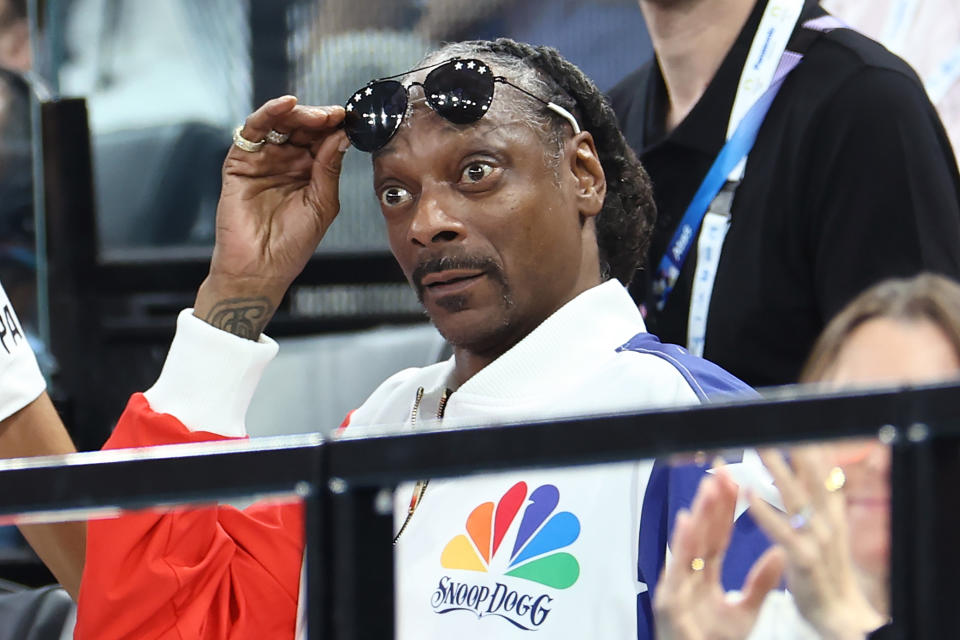 PARIS, FRANCE - JULY 28: Snoop Dogg (R) attends the Artistic Gymnastics Women's Qualification on day two of the Olympic Games Paris 2024 at Bercy Arena on July 28, 2024 in Paris, France. (Photo by Arturo Holmes/Getty Images)