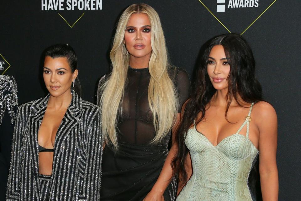 The reality TV star said how she has never felt ‘good enough’ compared to sisters Kourtney (left) and Kim (right) (AFP via Getty Images)