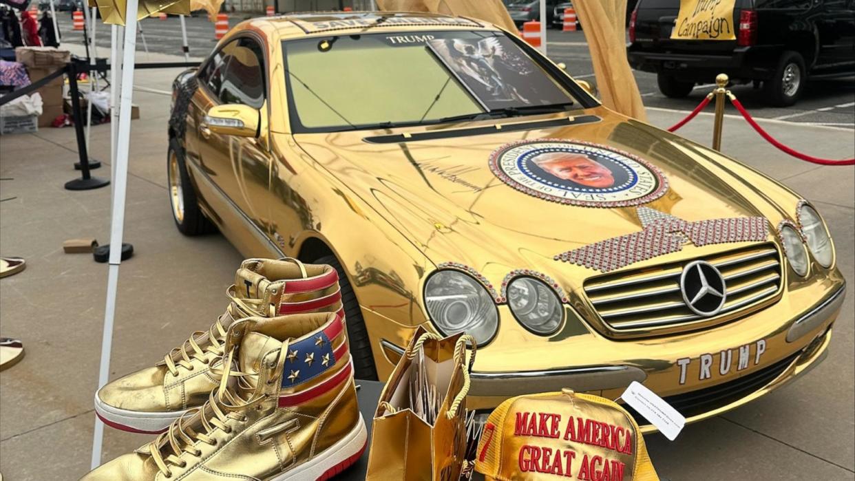 PHOTO: The celebration outside former President Donald Trump's Long Island rally on Wednesday included music blaring through speakers, golden cars with Trump's face on the front and bedazzled Trump jackets. (Lalee Ibssa/ABC News)