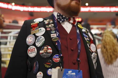 Oregon alternate RNC delegate Nathan Dahlin wears an assortment of political buttons at the Republican National Convention in Cleveland, Ohio, U.S. July 18, 2016. REUTERS/Aaron P. Bernstein