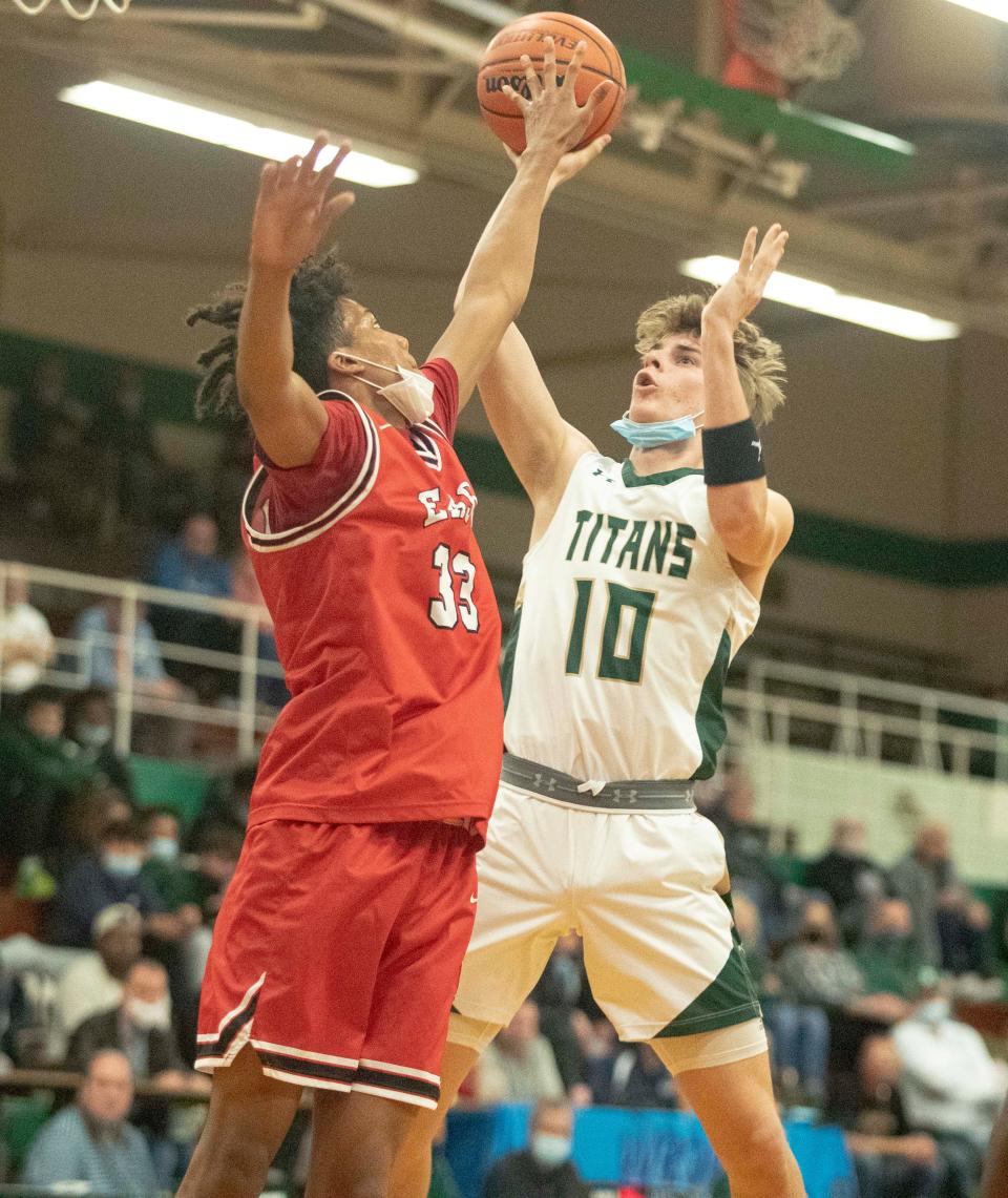 Boylan's Joey Appino shoots the ball against East's Matthew Hoarde at Boylan High School on Friday, Dec. 3, 2021, in Rockford.