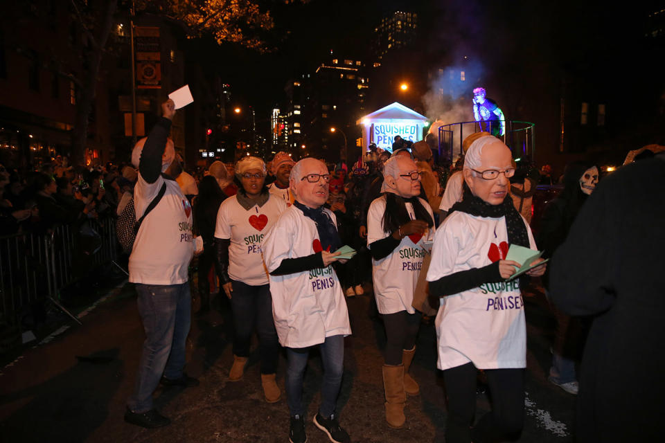 People wearing Hillary Clinton and Bernie Sanders masks march with along a float called “The Squished Penises” during the 43rd annual Village Halloween Parade in New York City on Oct. 31, 2016. (Gordon Donovan/Yahoo News)