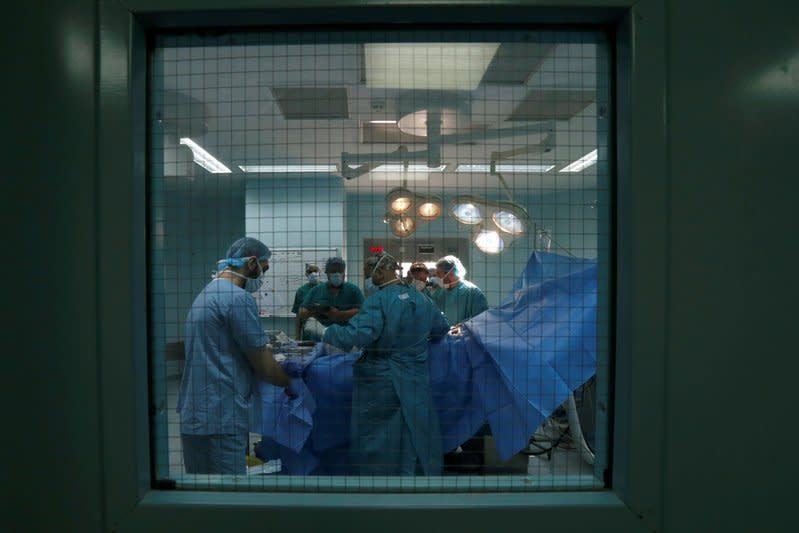 Doctors operate on Ismael Moustafa, 28, who was wounded in Syria, inside a hospital in Tripoli, Lebanon May 24, 2017. REUTERS/Mohamed Azakir