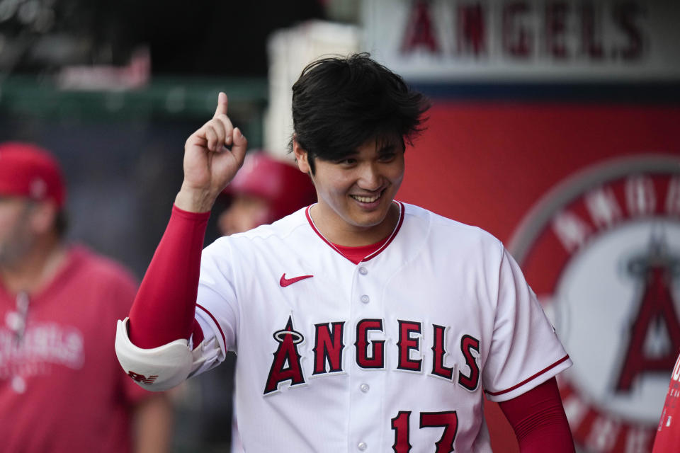 Los Angeles Angels' Shohei Ohtani gestures in the dugout before the team's baseball game against the Texas Rangers Saturday, May 6, 2023, in Anaheim, Calif. (AP Photo/Jae C. Hong)