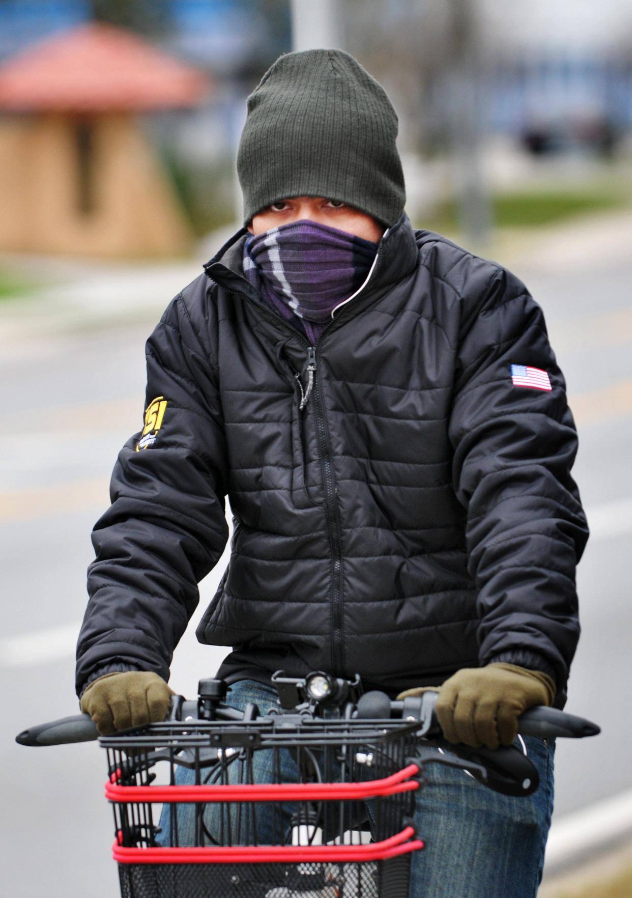 Jacksonville bicyclist Omar Saif bundled up to ride through temperatures in the 30s in this January 2015 photo.