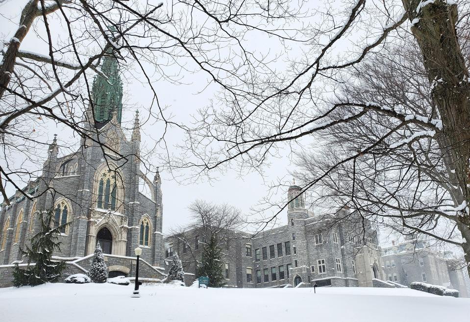 Snow falls Wednesday on the grounds of the former Mercyhurst North East campus in North East. Mercyhurst on Tuesday sold the 70-acre campus to Ehrenfeld Companies and Blue Ocean Investments of Baltimore, Maryland. The Our Lady of Perpetual Help chapel is shown at left.