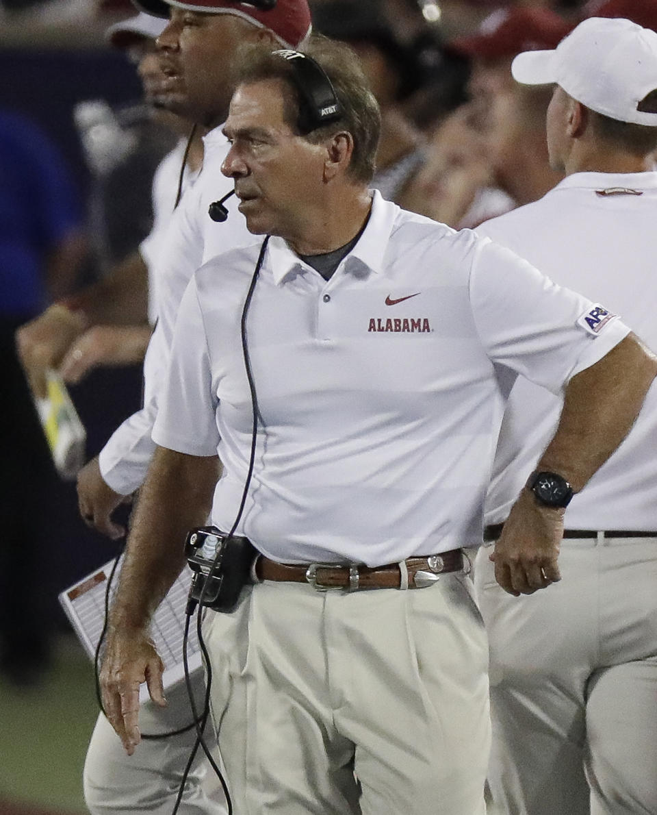 Alabama coach Nick Saban paces the sideline during the first half of an NCAA college football game against Louisville, Saturday, Sept. 1, 2018, in Orlando, Fla. (AP Photo/John Raoux)
