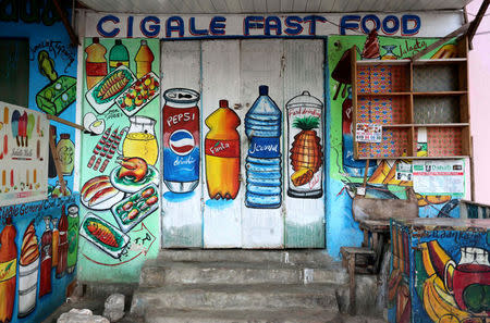 A mural on the wall of a fast food store illustrates food and drinks in Wabari district of Mogadishu, Somalia, June 8, 2017. REUTERS/Feisal Omar