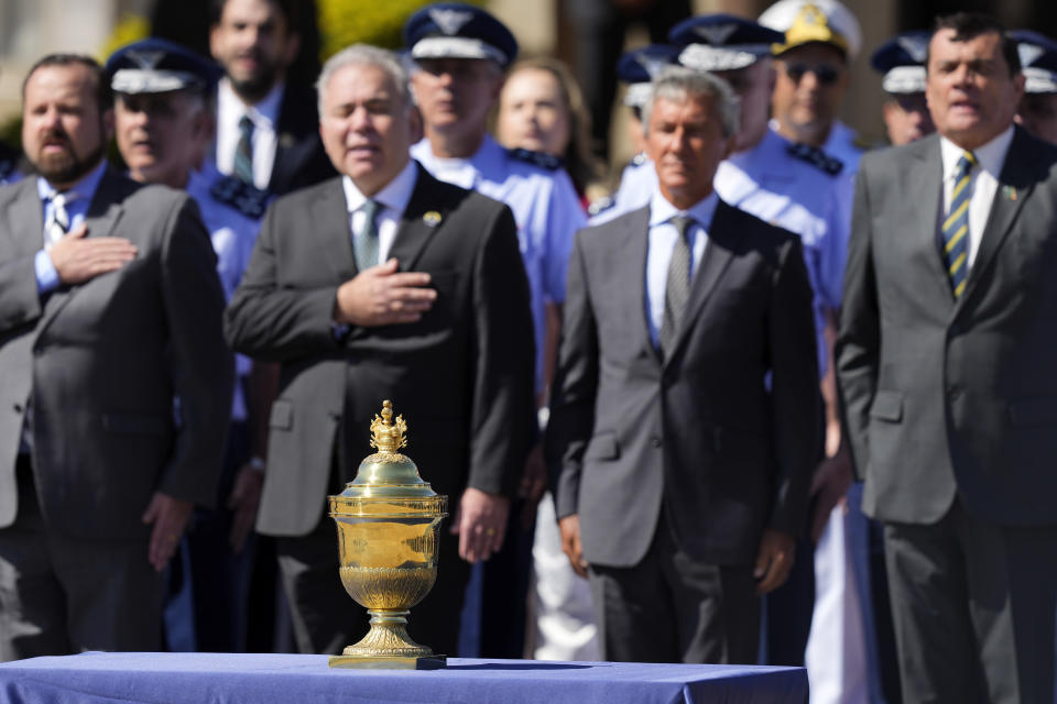 The reliquary of the heart of Brazil's former emperor Dom Pedro I is given a military honors ceremony upon its arrival to an air base in Brasilia, Brazil, Monday, Aug. 22, 2022. The heart arrived for display during the celebrations of Brazil's bicentennial on Sept. 7. (AP Photo/Eraldo Peres)