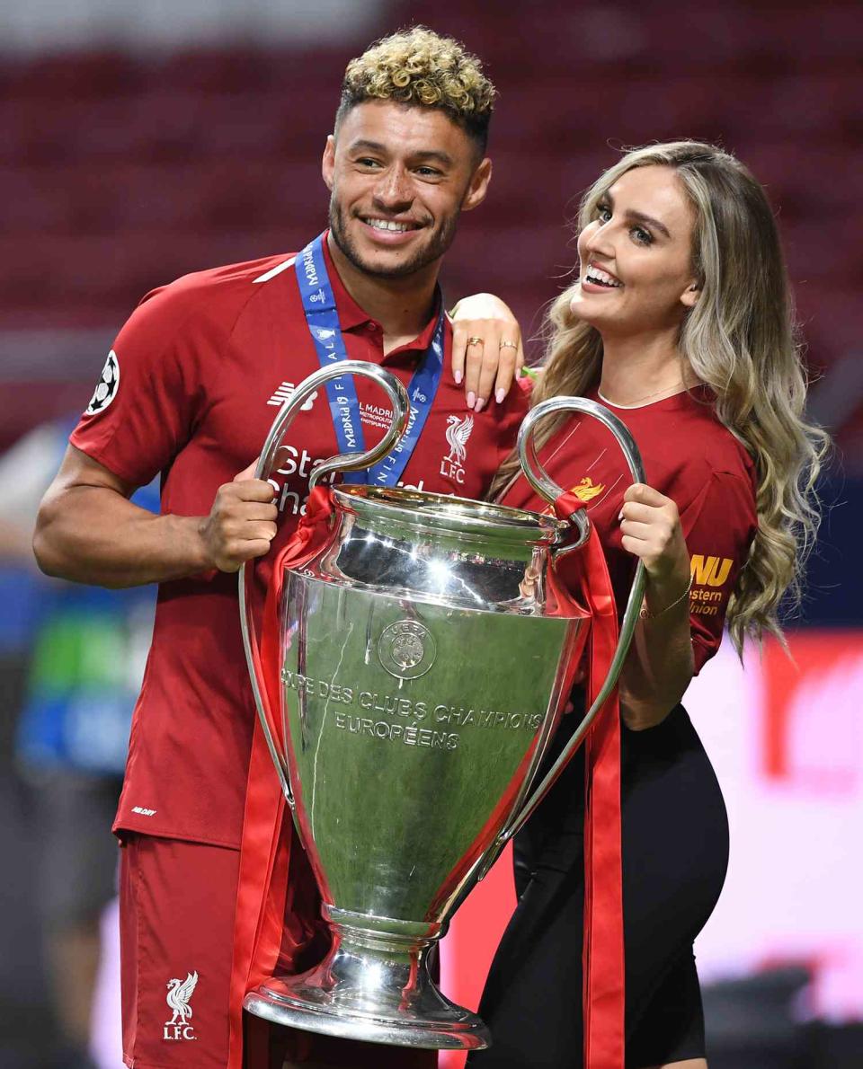Alex Oxlade-Chamberlain with his girlfriend Perrie Edwards after his side won during the UEFA Champions League Final between Tottenham Hotspur and Liverpool at Estadio Wanda Metropolitano on June 01, 2019 in Madrid, Spain