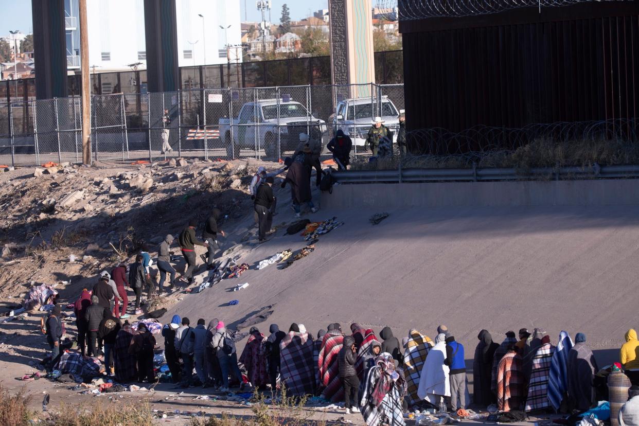 Migrants who crossed the Rio Grande from Ciudad Juarez into El Paso, Texas in order to seek asylum brave freezing temperatures as they awaited to be processed by Customs and Border Protection in December 2022.