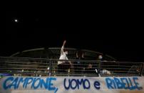 People mourn the death of Argentine soccer legend Diego Maradona, in Naples