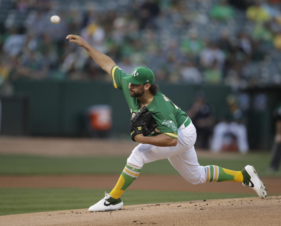 Oakland Athletics pitcher Tanner Roark works against the Houston Astros during the first inning of a baseball game Friday, Aug. 16, 2019, in Oakland, Calif. (AP Photo/Ben Margot)