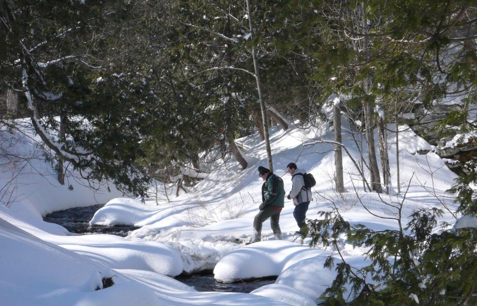 This March 9, 2008 file photo shows hikers along the Bruce Trail on the Niagara Escarpment in Milton, west of Toronto. The Bruce Trail is the oldest and longest marked hiking trail in Canada at 521 miles (840 kilometers) long and over 273 miles (440 kilometers) of side trails, many of which are in Ontario. While autumn turns the trails into blazing streams of fiery reds, pumpkin orange and honeyed hues, the winter snow makes it perfect for cross-country skiing and snow-shoeing. (AP Photo/The Canadian Press, J.P. Moczulski)