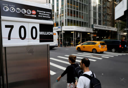 A sign displays that the Powerball jackpot is $700 million at a newsstand in New York City, U.S., August 23, 2017. REUTERS/Brendan McDermid