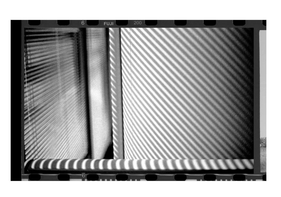 Light shines through blinds in the Milwaukee Journal newsroom office Sentinel office taken with a Pentax K1000 35mm film camera in Milwaukee in June, 2023.