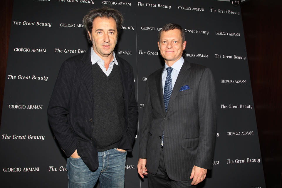 This Nov. 12, 2013 image released by Starpix shows director Paolo Sorrentino, left, and Criterion CEO Peter Becker at a private screening of the film, "The Great Beauty," in New York. Sorrentino's Fellini-esque film depicts Rome in all of its decadent glory, with luxurious focus on the city's visual wonders as well as the malaise of some of its inhabitants, a mood that reflects the nation's ongoing economic and political paralysis. It is one of five films nominated for an Academy Award for best foreign picture, with the winner to be presented with an Oscar on Sunday, March 2, 2014. (AP Photo/Starpix, Kristina Bumphrey, file)