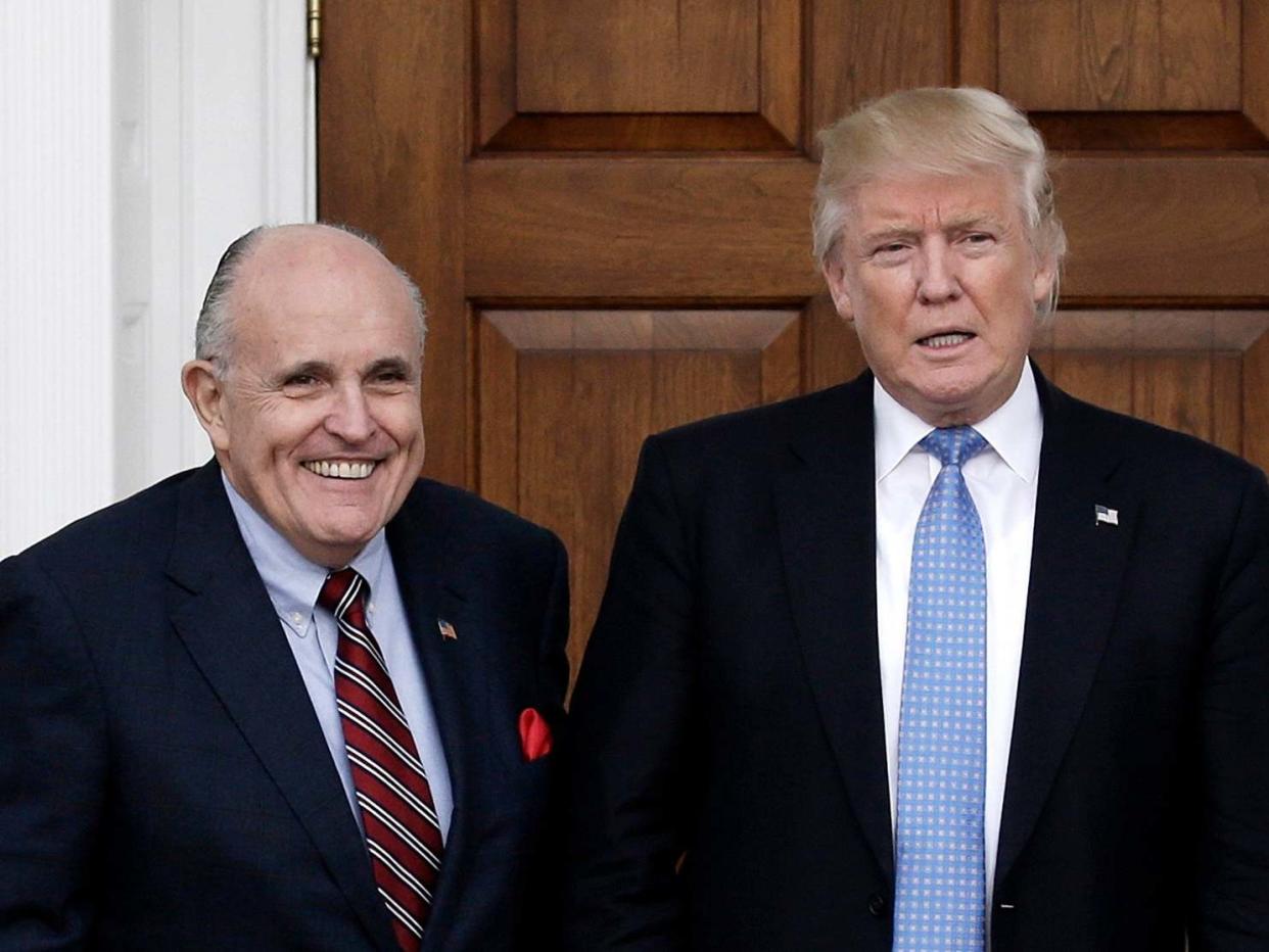 Donald Trump's personal lawyer Rudy Giuliani (left) with the US president (right): Peter Foley/EPA