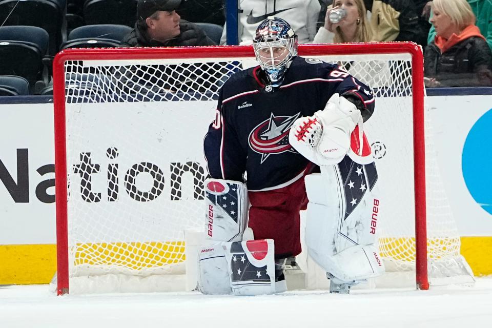 Mar 3, 2023; Columbus, Ohio, USA;  Columbus Blue Jackets goaltender Elvis Merzlikins (90) sits back in net after Seattle Kraken left wing Brandon Tanev (13) scored an empty-net goal during the third period of the NHL hockey game at Nationwide Arena. The Blue Jackets lost 4-2. Mandatory Credit: Adam Cairns-The Columbus Dispatch