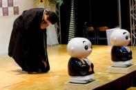 Female Buddhist monk Koyu Osawa, winner of the Handsomest Monk Contest, bows to spectators as she takes part in the contest at Life Ending Industry Expo in Tokyo, Japan, August 22, 2016. REUTERS/Kim Kyung-Hoon