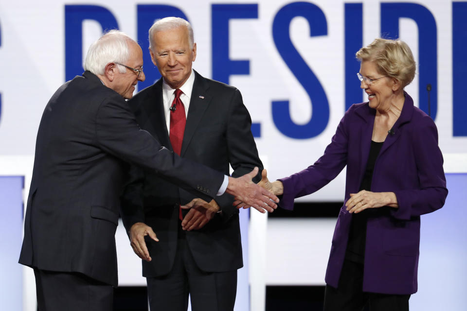 Democratic presidential candidate Sen. Bernie Sanders, I-Vt., left, former Vice President Joe Biden and Sen. Elizabeth Warren, D-Mass., right, participate in a Democratic presidential primary debate hosted by CNN/New York Times at Otterbein University, Tuesday, Oct. 15, 2019, in Westerville, Ohio. (AP Photo/John Minchillo)