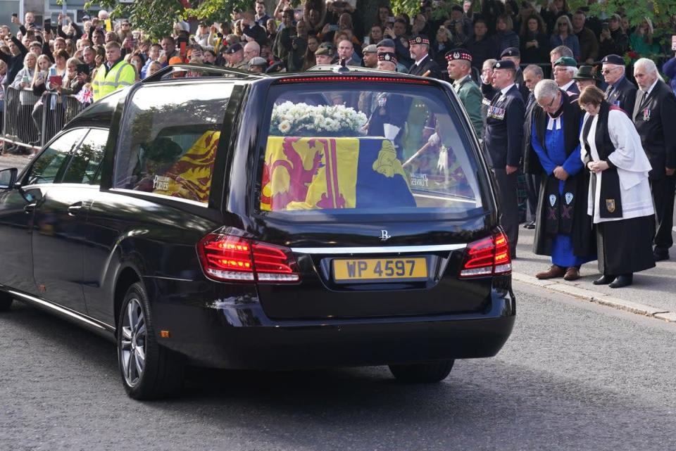 The hearse carrying the Queen’s coffin passes through Ballater. Andrew Milligan/PA (PA Wire)