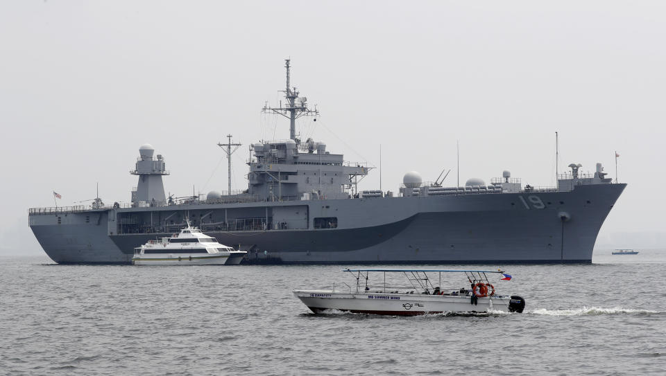 The USS Blue Ridge (LCC-19), the U.S. 7th Fleet Flagship, is anchored off Manila Bay west of Manila, Philippines for a routine port call Wednesday, March 13, 2019. Capt. Eric Anduze, Commander of the USS Blue Ridge, renewed an American vow to "sail, fly and operate wherever the law allows us to" amid China's objection to U.S. military presence in the disputed South China Sea. (AP Photo/Bullit Marquez)