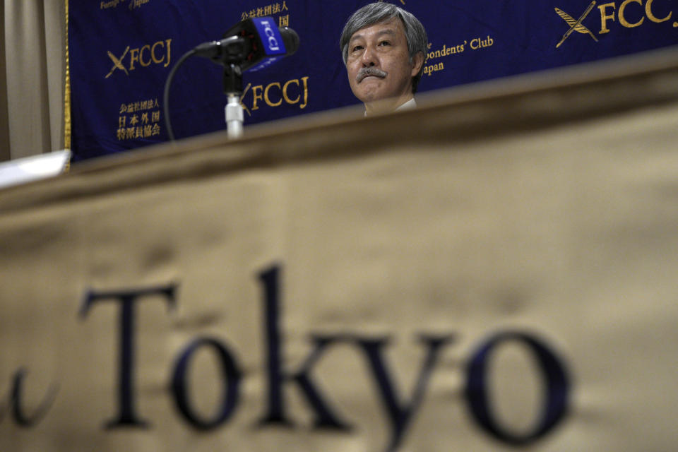 Dr. Naoto Ueyama, chairman of Japan Doctors Union, poses for photographers prior to a press conference Thursday, May 27, 2021, in Tokyo. Dr. Ueyama warned Thursday that holding the one-year-delayed Tokyo Olympics in two months could lead to the spread of mutant variants of the coronavirus. (AP Photo/Eugene Hoshiko)