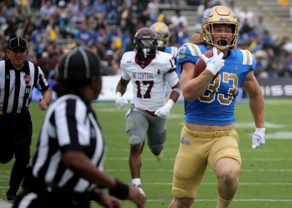 Carson Steele runs for UCLA.