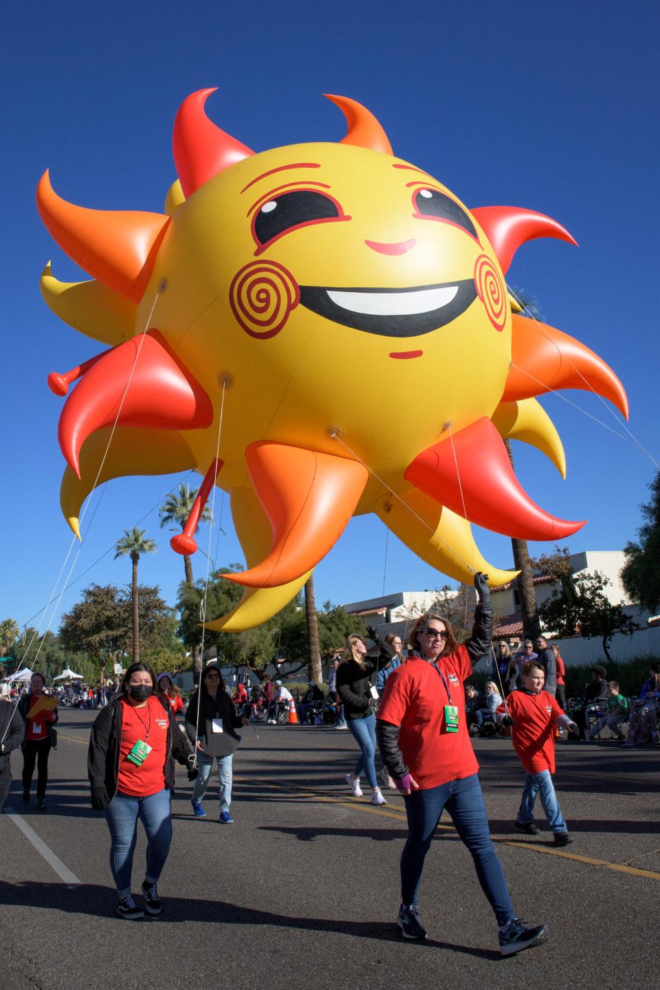 The Fiesta Bowl mascot Spirit balloon is walked down Central Avenue in the 2021 Fiesta Bowl Parade in Phoenix on Dec. 18, 2021.