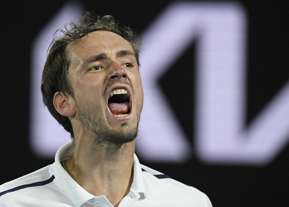 Russia's Daniil Medvedev reacts after winning a point against Greece's Stefanos Tsitsipas during their semifinal match at the Australian Open tennis championship in Melbourne, Australia, Friday, Feb. 19, 2021.(AP Photo/Andy Brownbill)