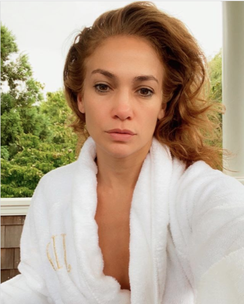 Jennifer Lopez in a robe without any makeup