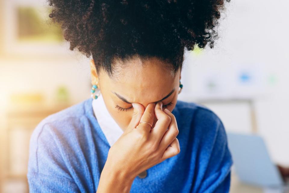 <p>Getty</p> Stock image of a woman with a headache