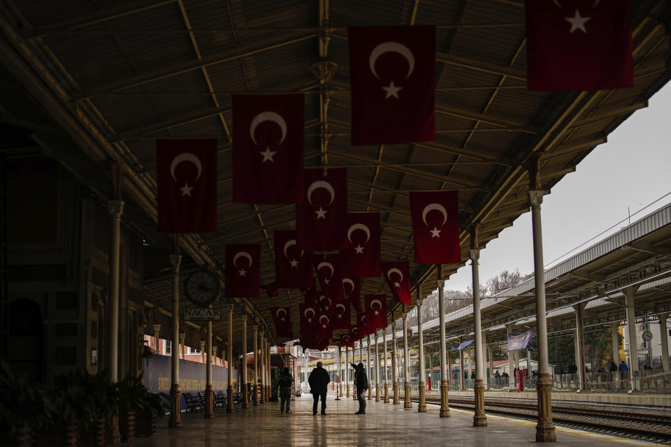 People walk along Sirkeci railway station, in Istanbul, Turkey, Wednesday, March 20, 2024. The station was the ending terminal of the Orient Express that operated between Paris and Istanbul from 1883 until 2009. (AP Photo/Emrah Gurel)