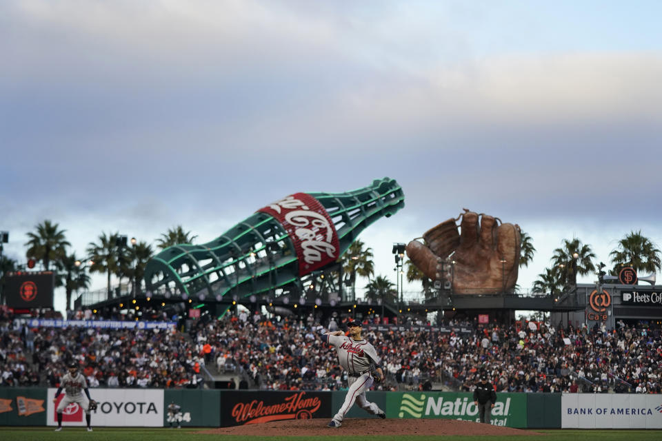 Atlanta Braves' Charlie Morton, bottom, pitches against the San Francisco Giants during the third inning of a baseball game in San Francisco, Saturday, Sept. 18, 2021. (AP Photo/Jeff Chiu)