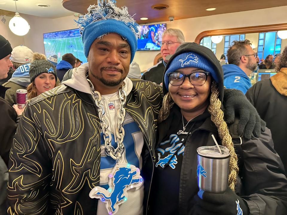 Ray Wells and Sharene Bryant called Sunday night’s playoff between the Detroit Lions and the L.A. Rams a very big deal for the city. The two walked into Elwood Bar and Grill chanting “Go Lions!” and throwing high fives to other patrons. (Credit: Dana Afana,Detroit Free Press)