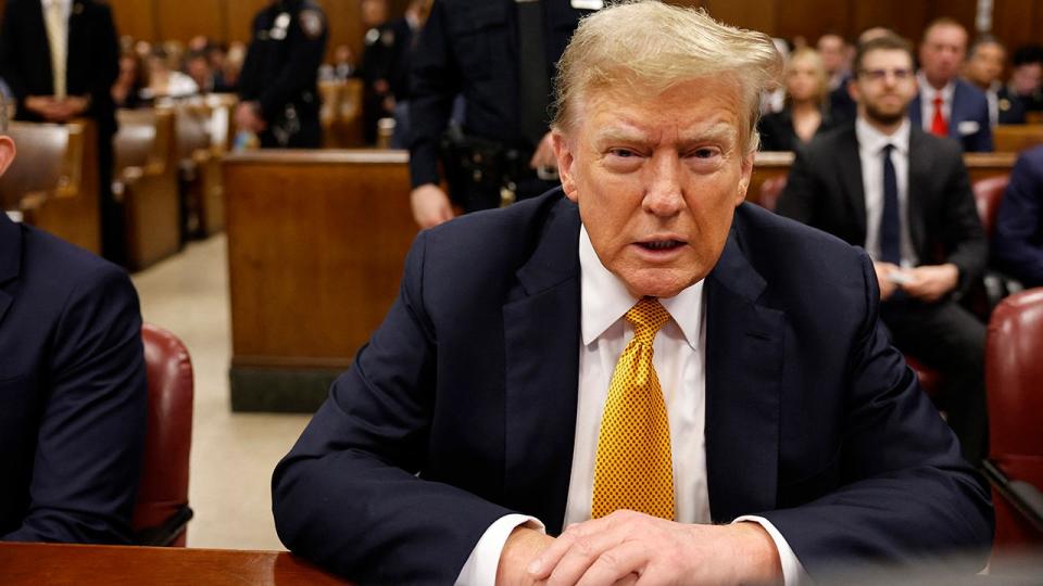 Donald Trump sits in the courtroom during his hush money trial